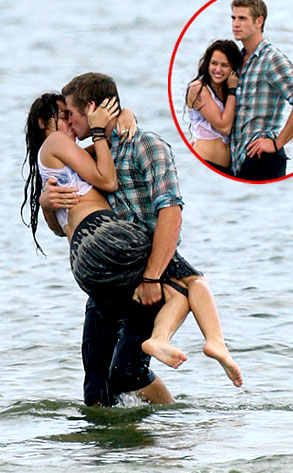 Miley Cyrus making out with Liam Hemsworth on the beach
