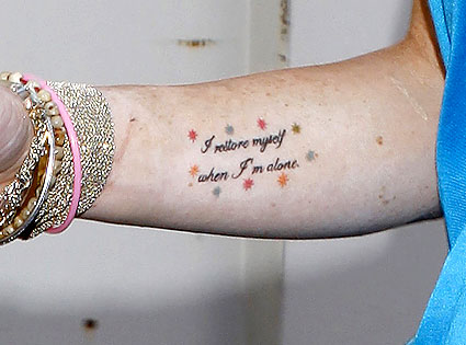 This celebrity hit a purse party on Robertson Boulevard with her tattoo on 