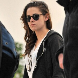 Kristen Stewart arrives at LAX behind a pair of sunglasses.