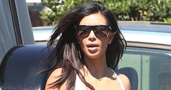Kim Kardashian Tries And Fails To Beat The Heat In Tight Long Skirt