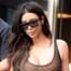 Kim Kardashian Bares All While Going Braless in Sheer Bodysuit